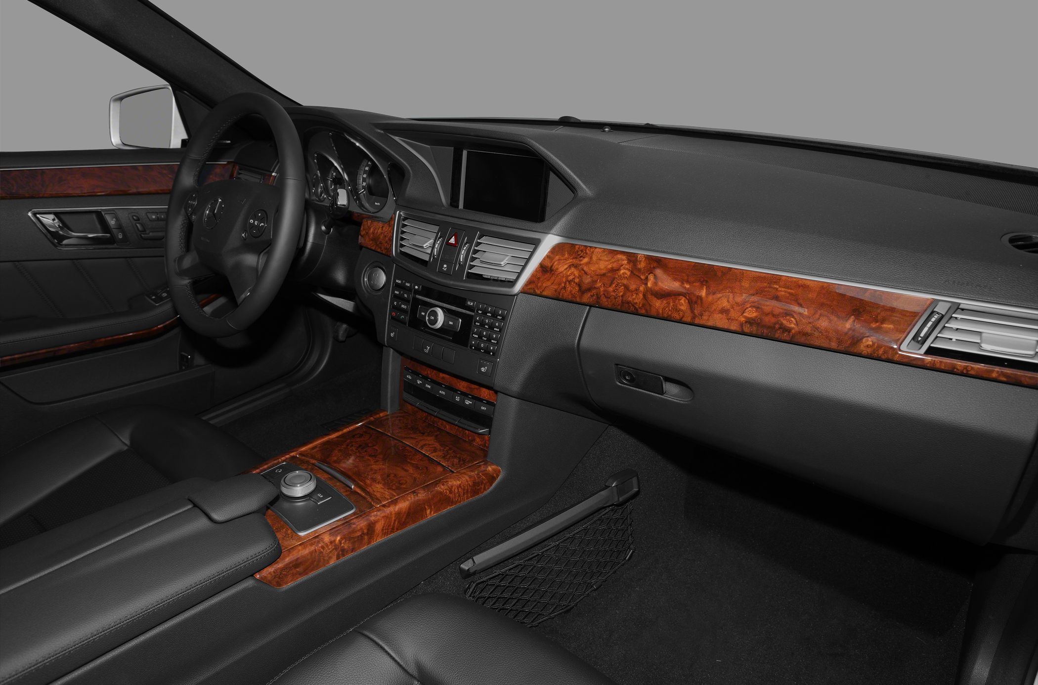Wood trim dashboard and center console with leather interior.