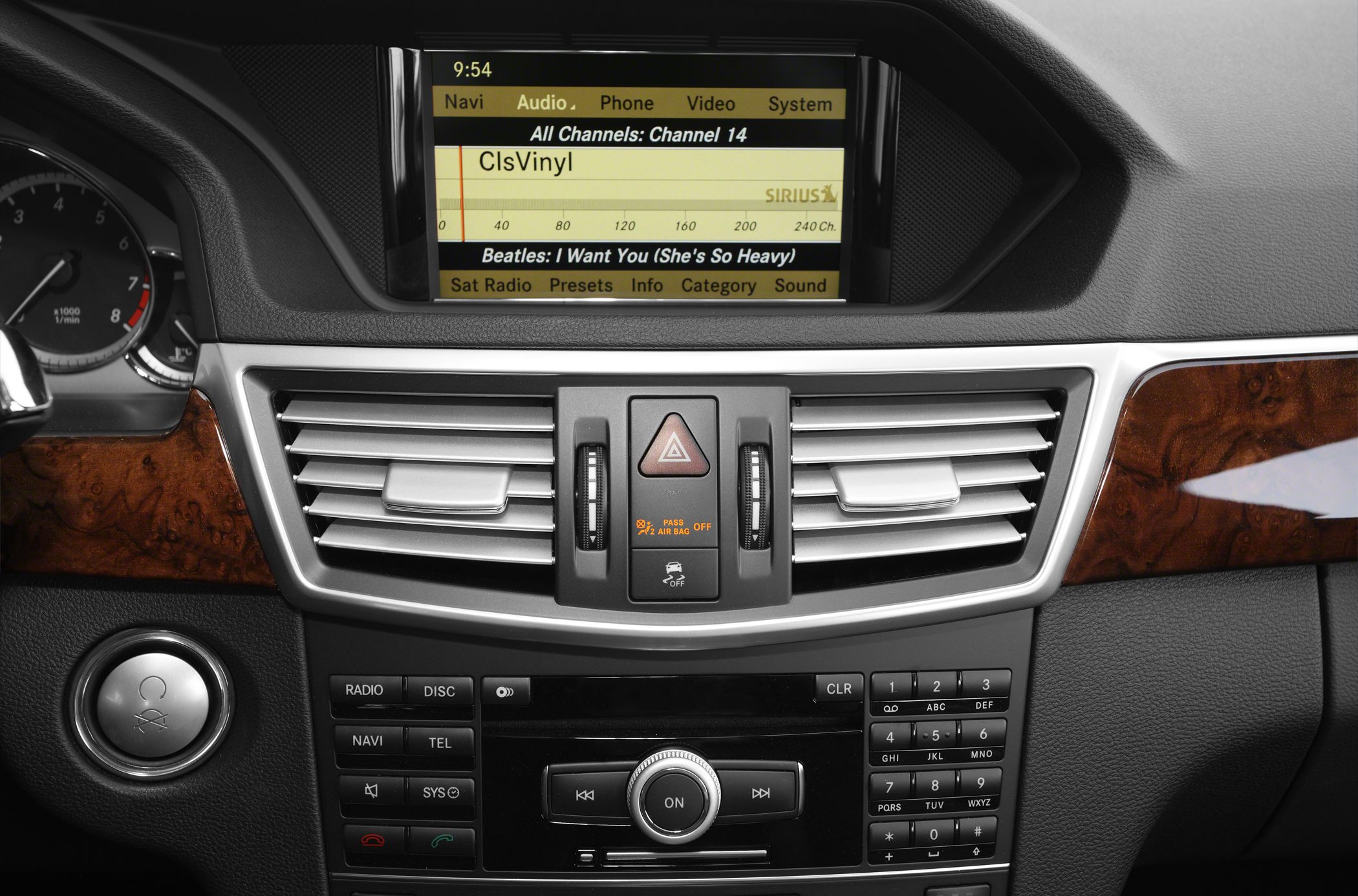 Multimedia system display and dual air vents in car dashboard