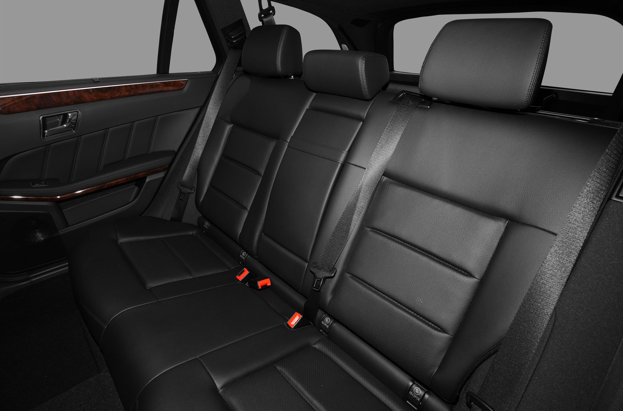 Black leather rear seats with ISOFIX child seat anchors and wood trim