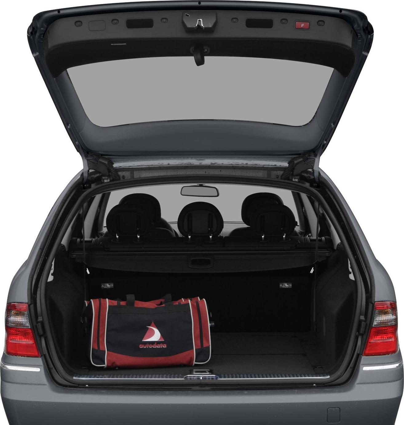 Open rear trunk with spacious cargo area and travel bag
