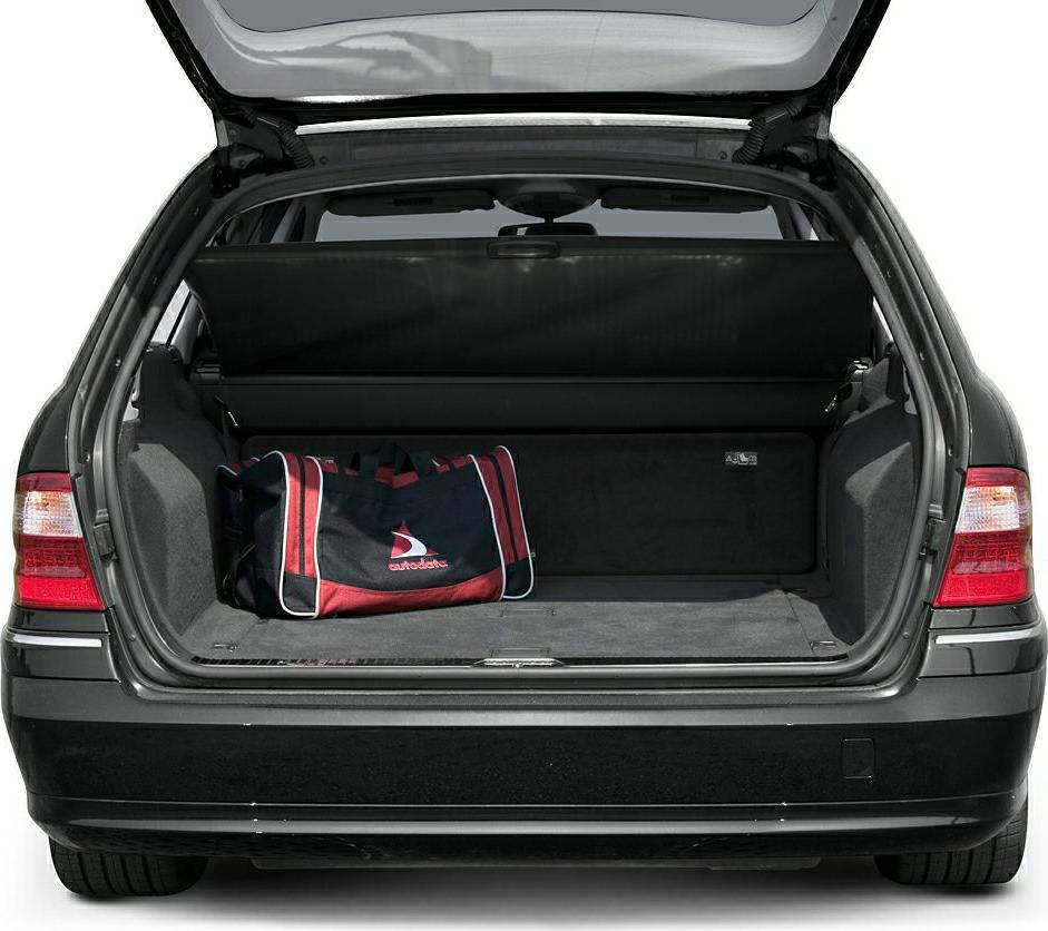 Open trunk with retractable cargo cover and sports bag inside