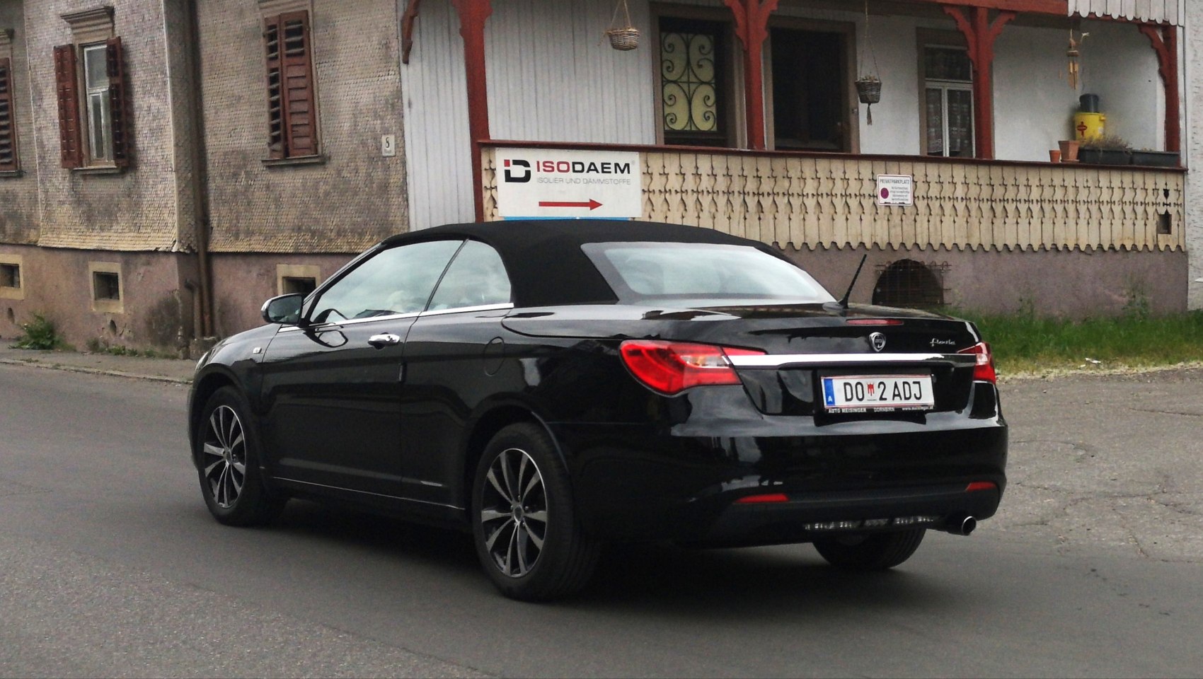 Black convertible with soft roof and alloy wheels