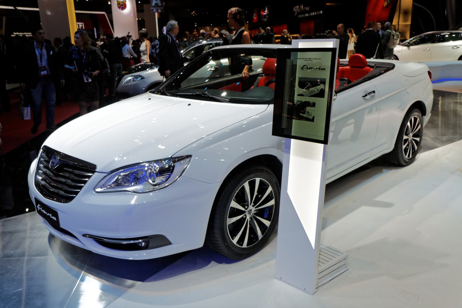 White convertible with red leather interior and alloy wheels