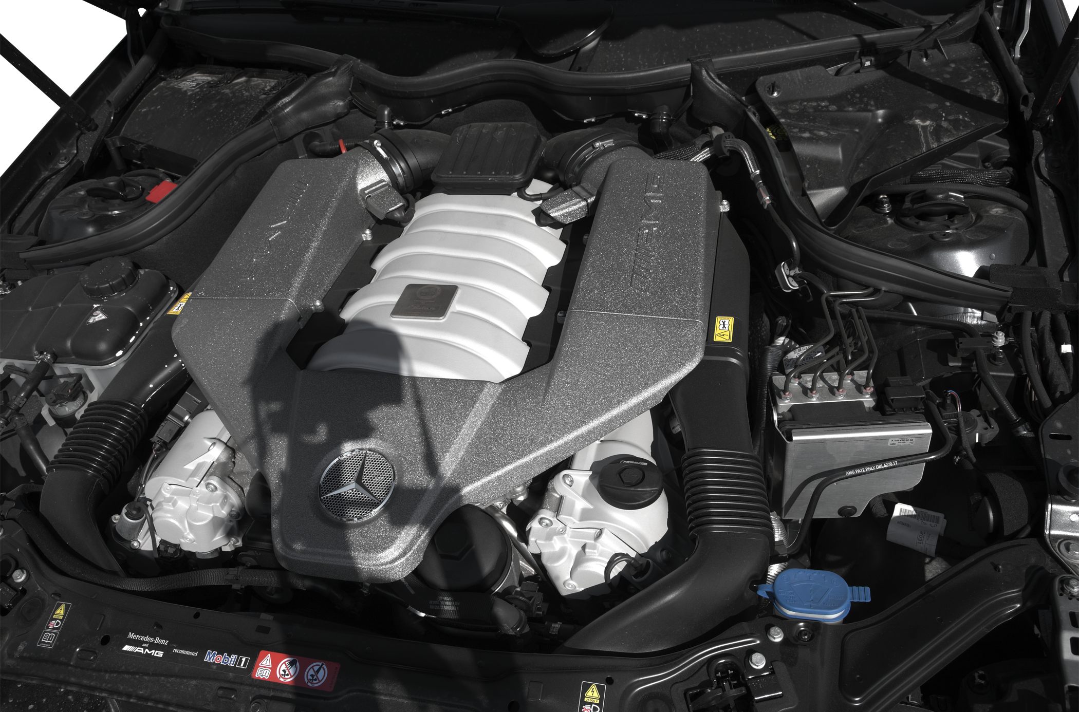 AMG enhanced V8 engine bay with detailed components and Mercedes emblem