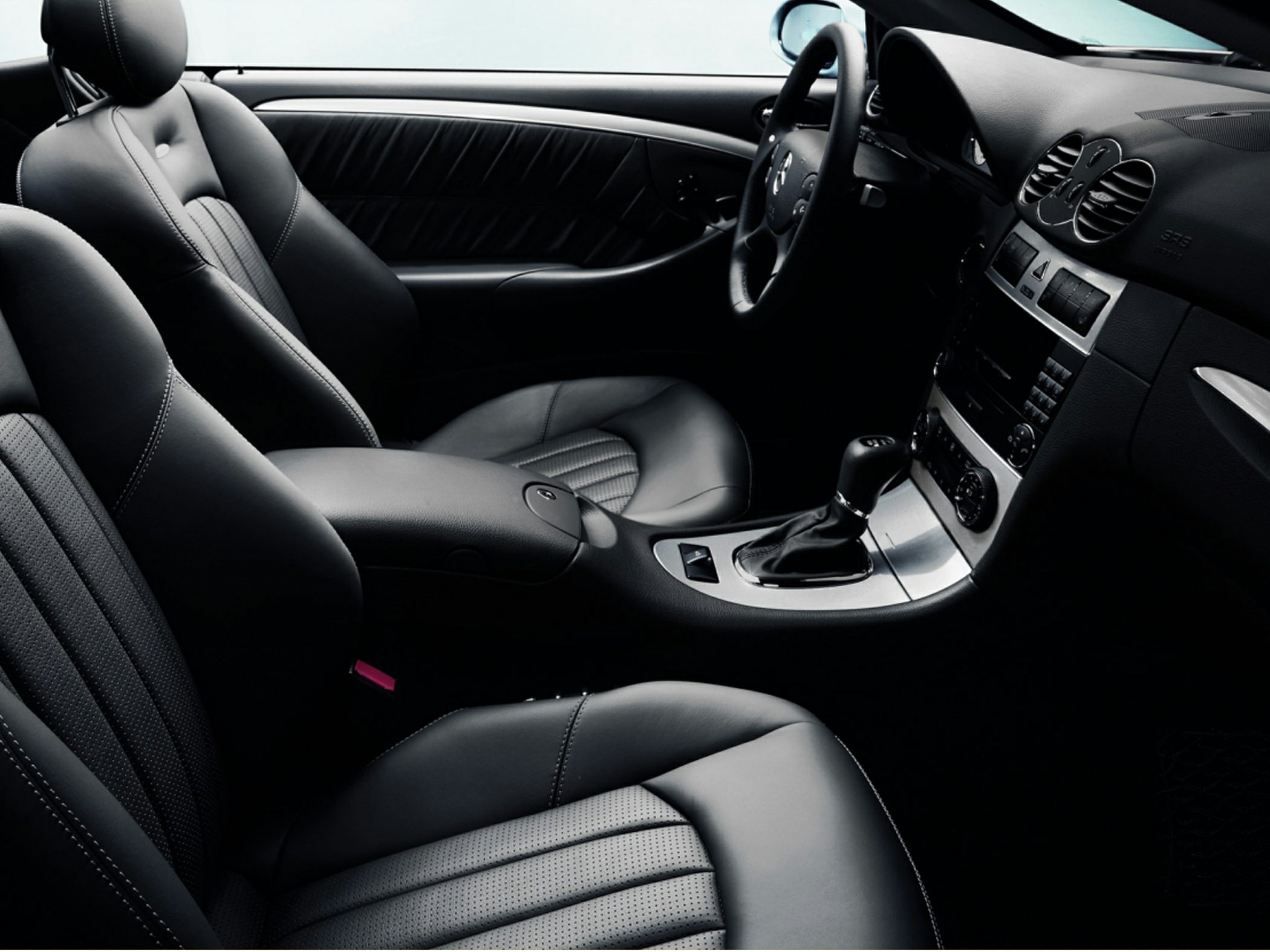 Luxury black leather seats and modern dashboard with automatic gear shift