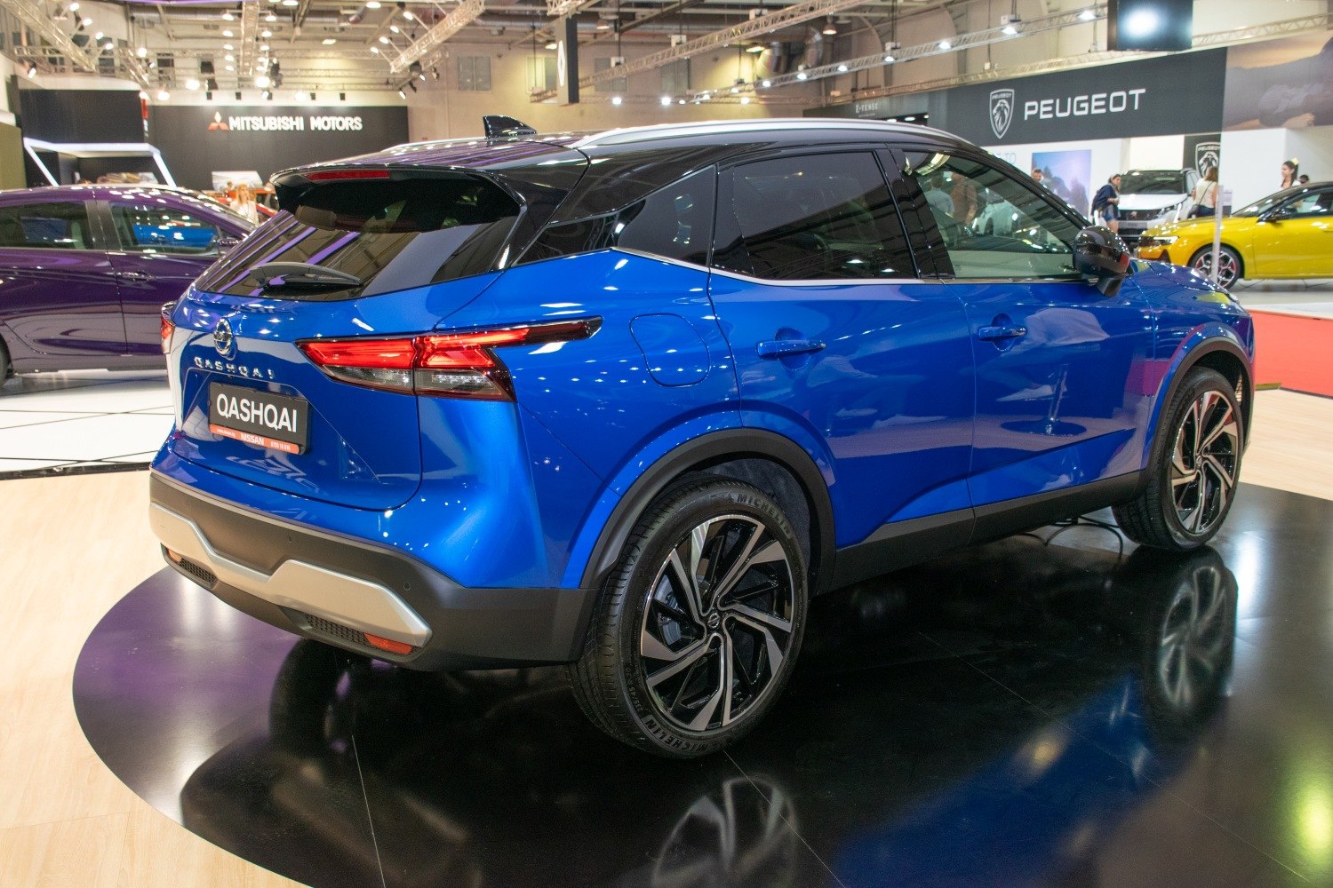 Blue SUV rear side with modern taillights and alloy wheels