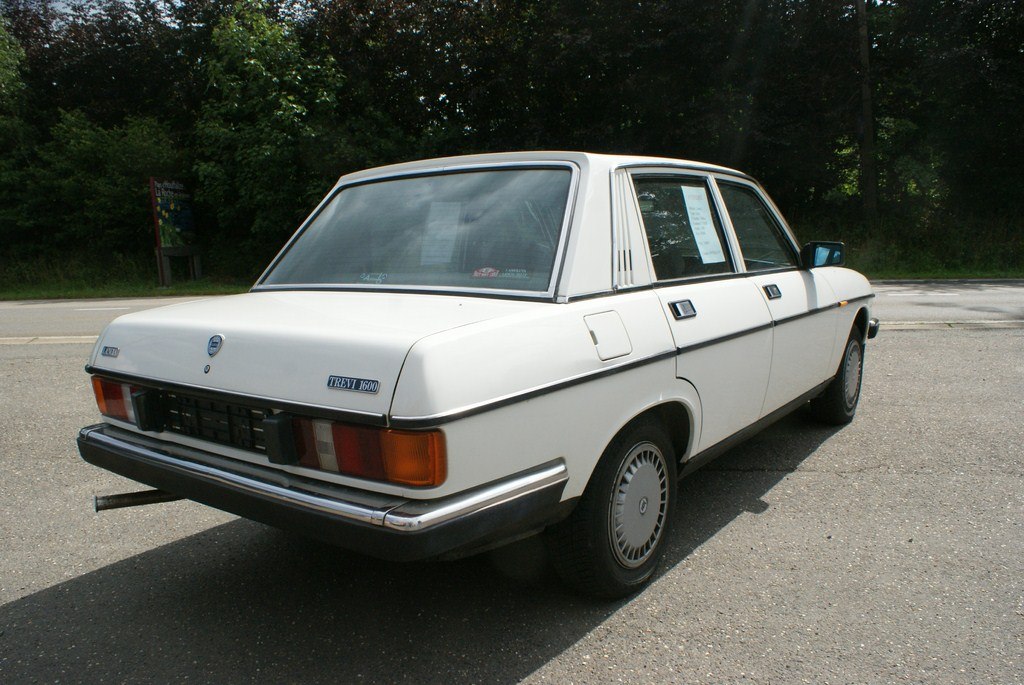Rear view of vintage sedan with classic 1980s squared design and tail lights