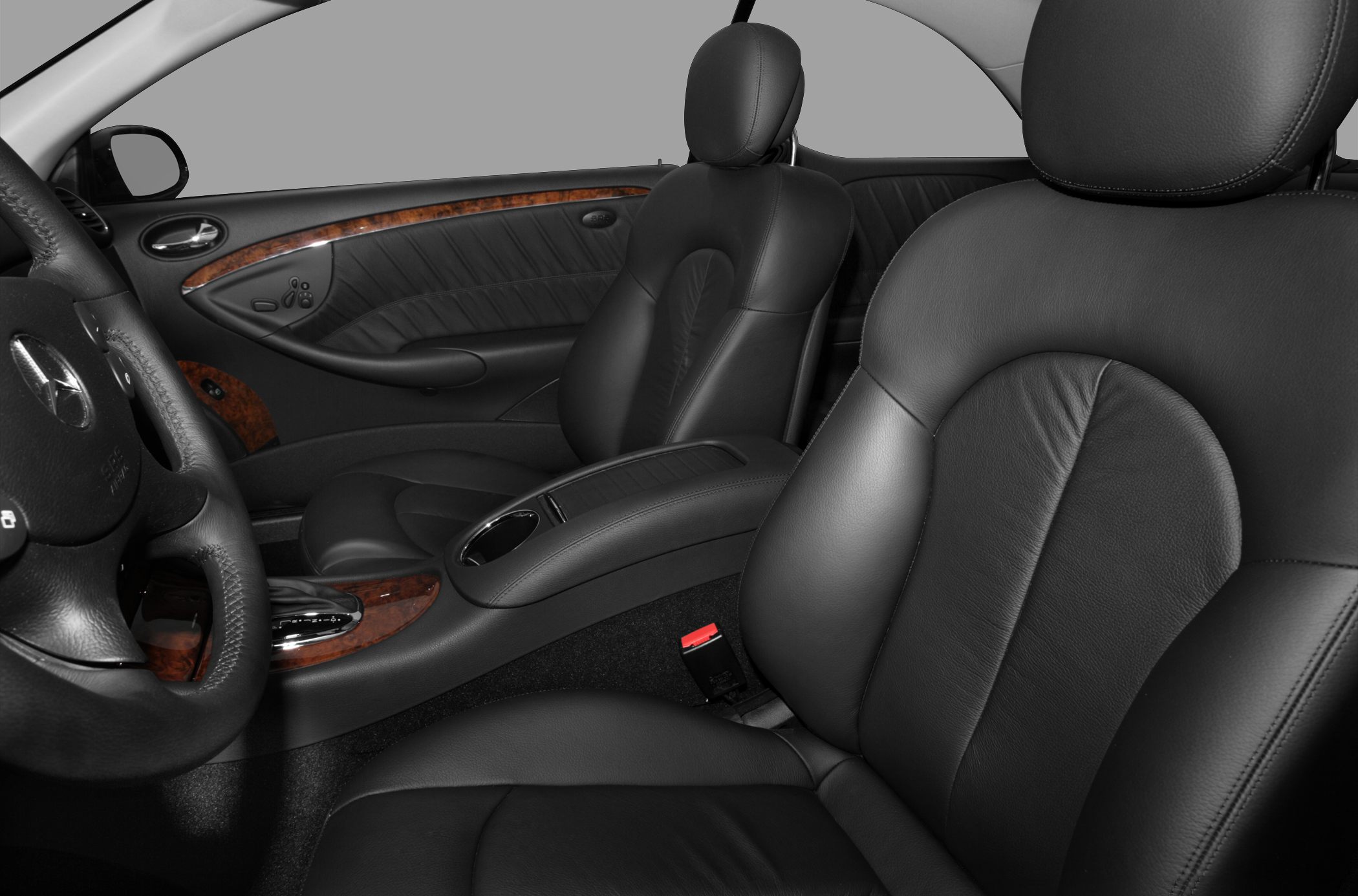 Premium black leather seats with wooden trim and front cabin interior