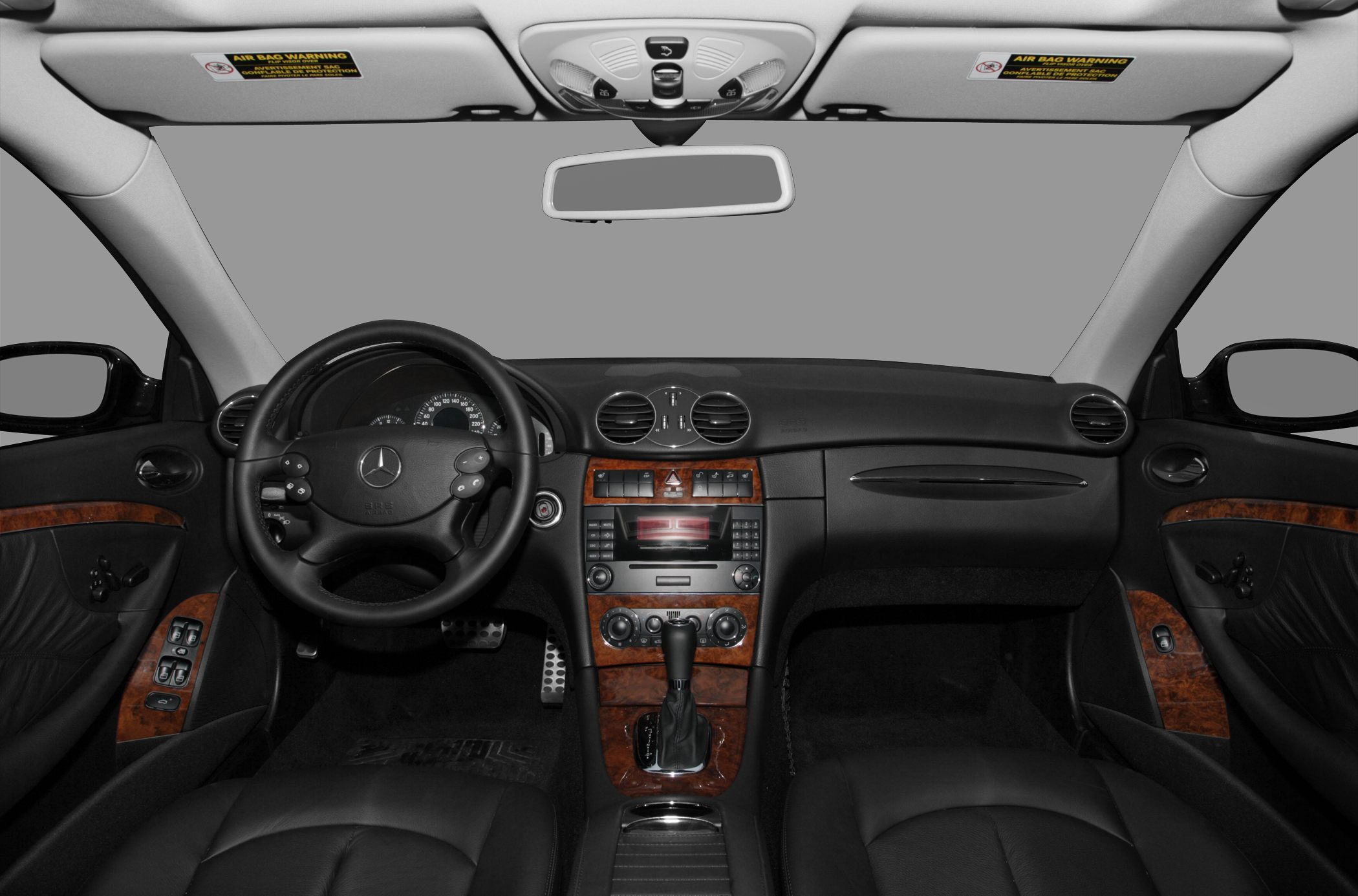 Luxury car dashboard with wood trim and leather seats