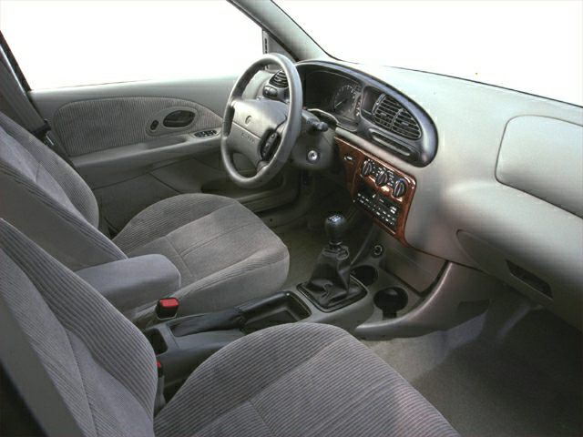 Interior with manual transmission, wood trim, and fabric seats