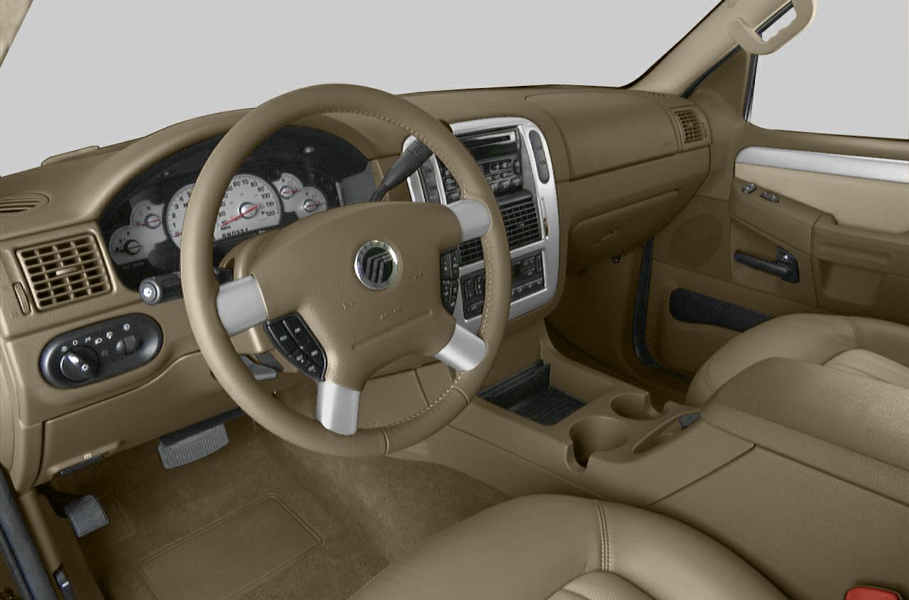 Tan steering wheel, dashboard, and front interior console.