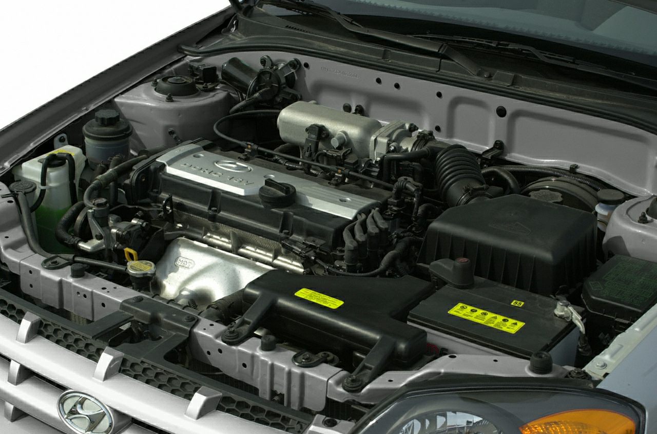 Detailed view of compact engine bay with major engine components and fluid reservoirs