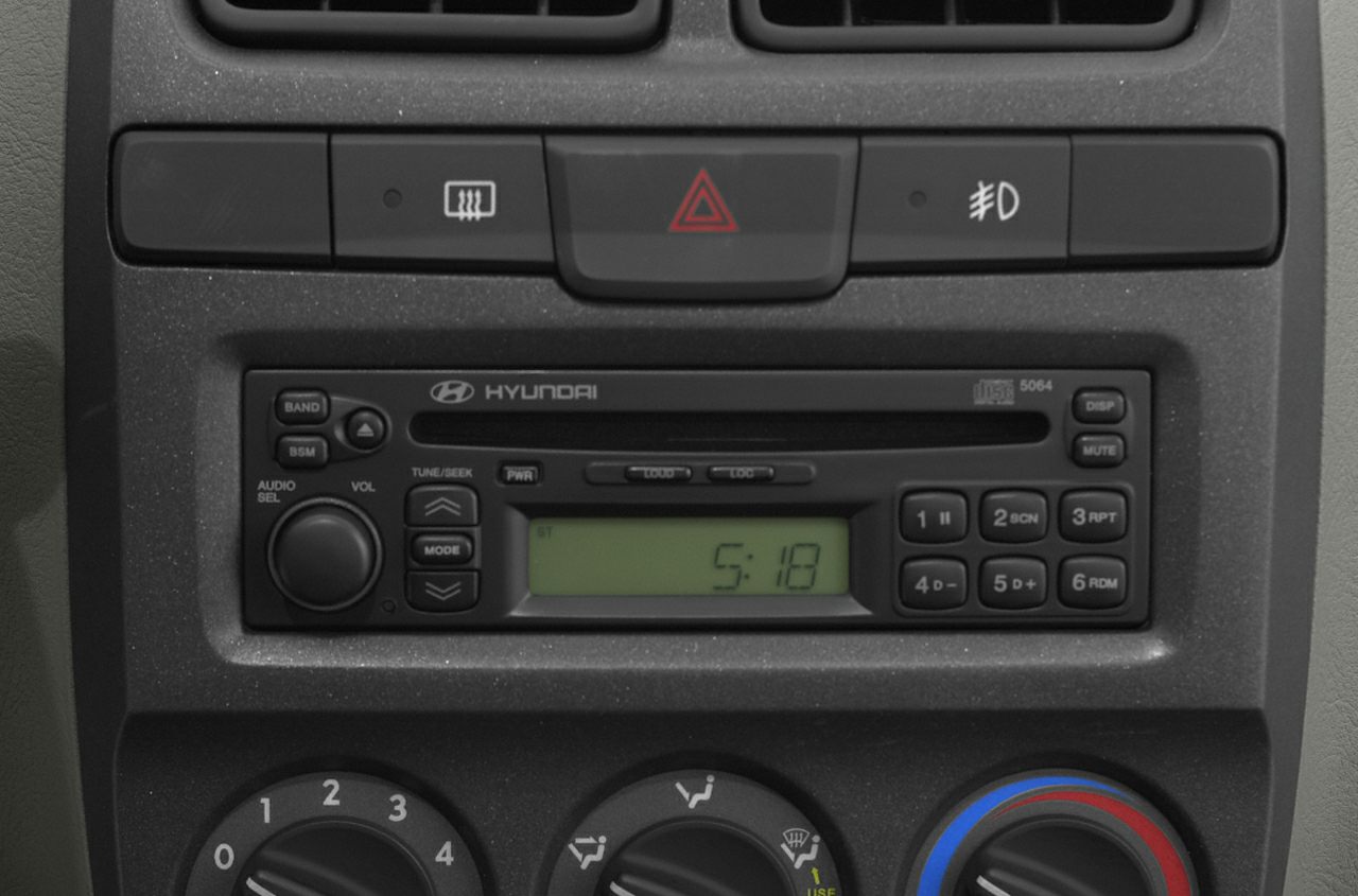 Vintage car stereo and climate control knobs with button layout
