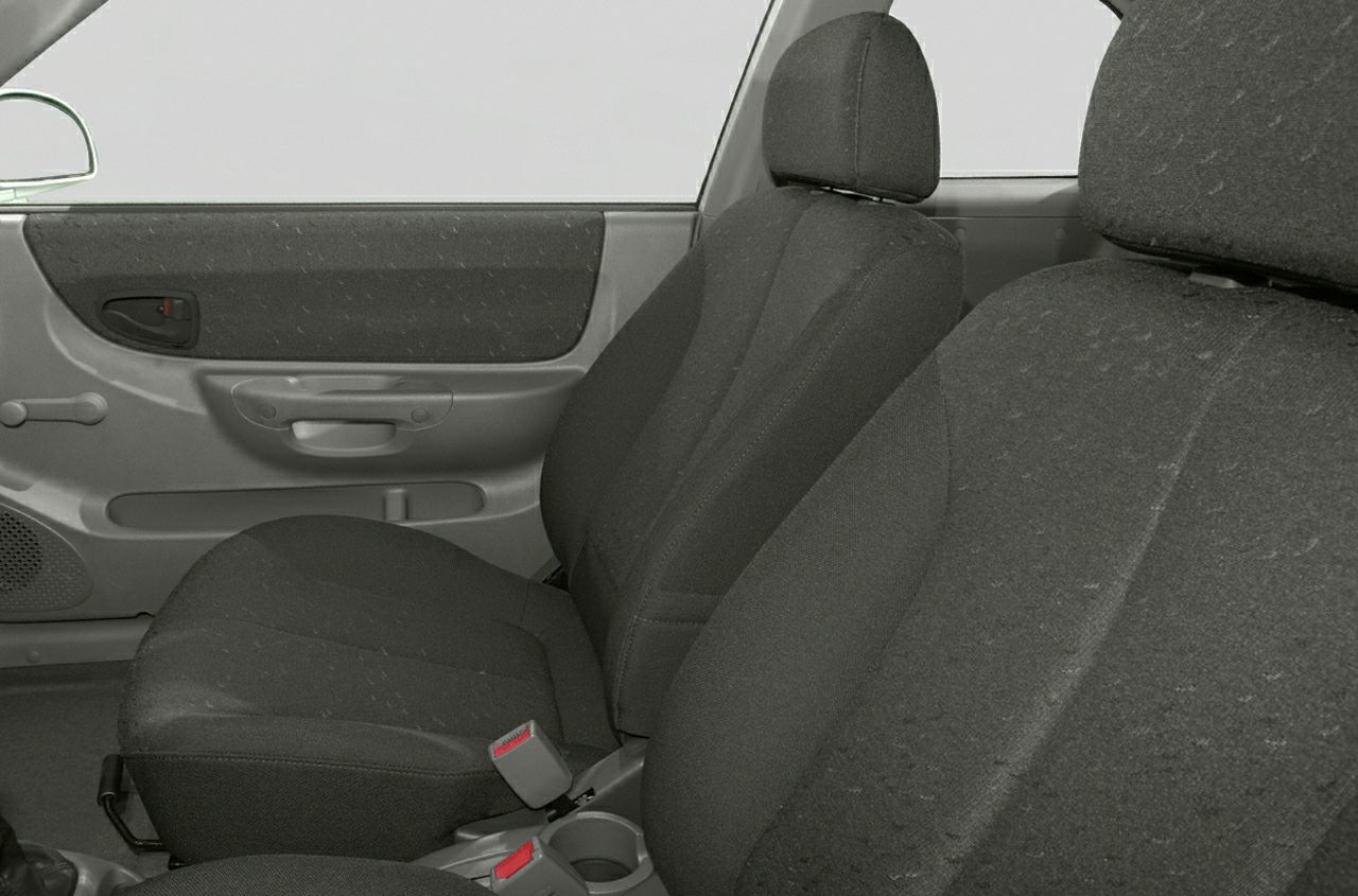 Fabric car seats and door panel with manual window crank and cup holder