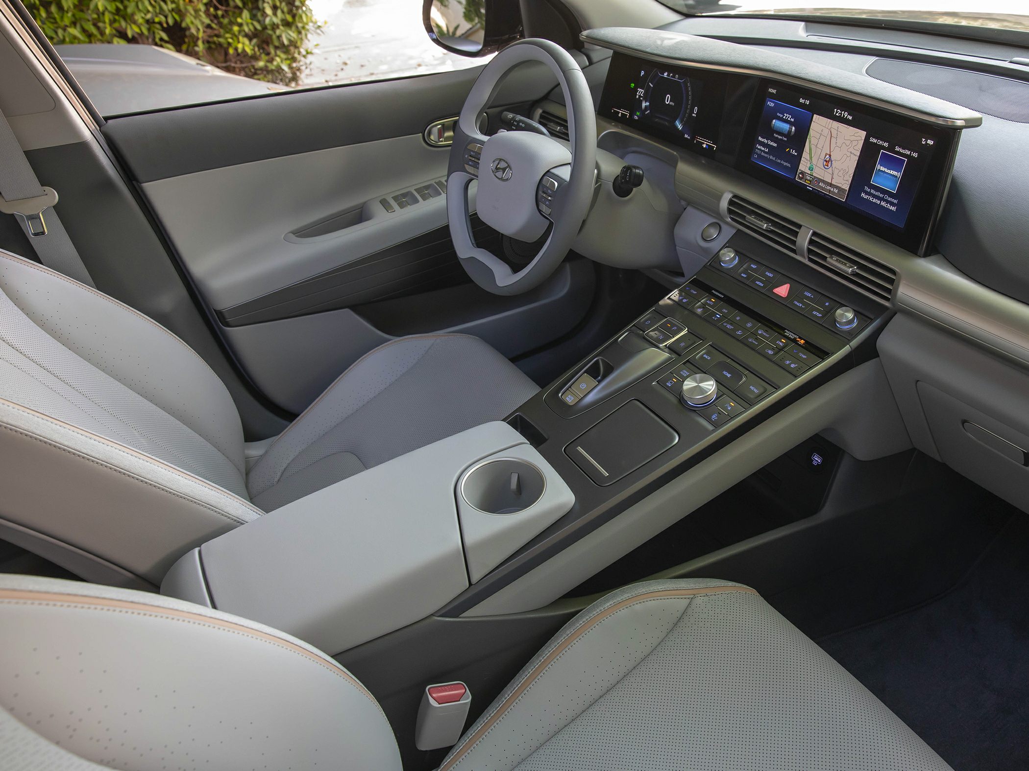Digital instrument cluster and ergonomic steering wheel with sleek center console