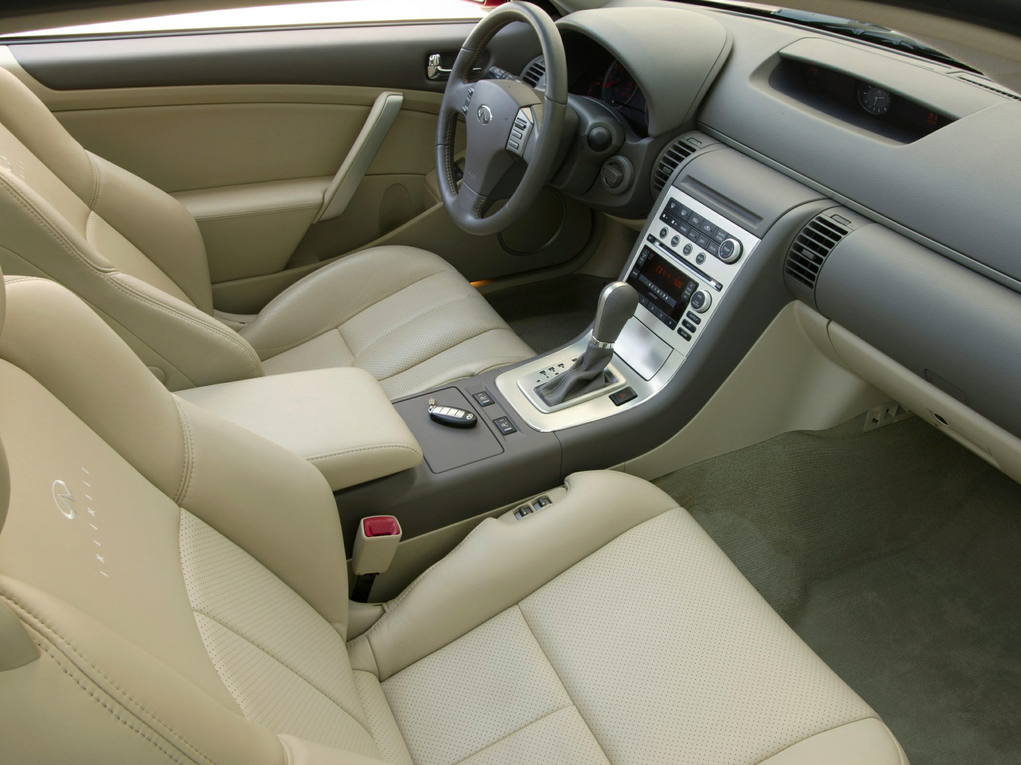 Beige leather seats with dashboard and center console