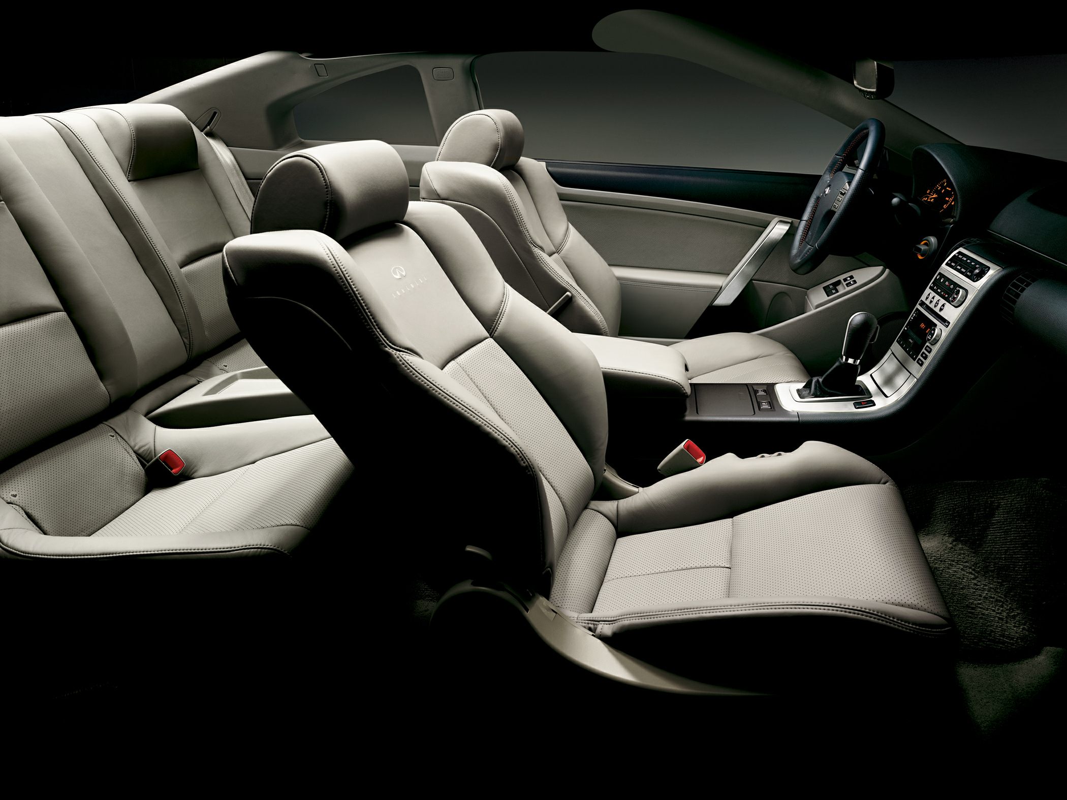 Leather seats and dashboard of a sporty coupe interior