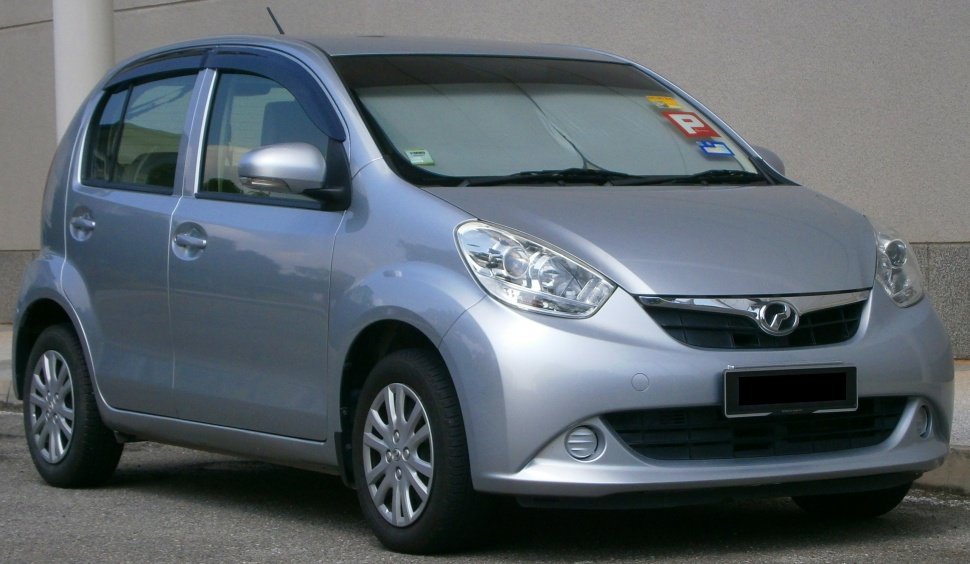 Silver compact hatchback with large headlights and aerodynamic design