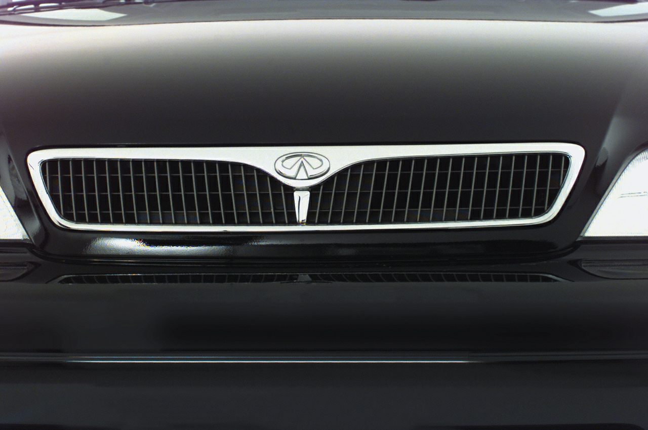 Close-up of Infiniti G20 front grille with chrome trim and emblem