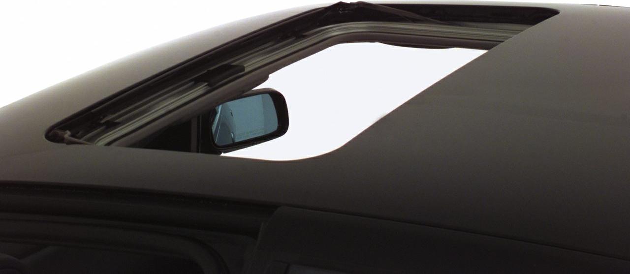 Open sunroof with visible side mirror reflection