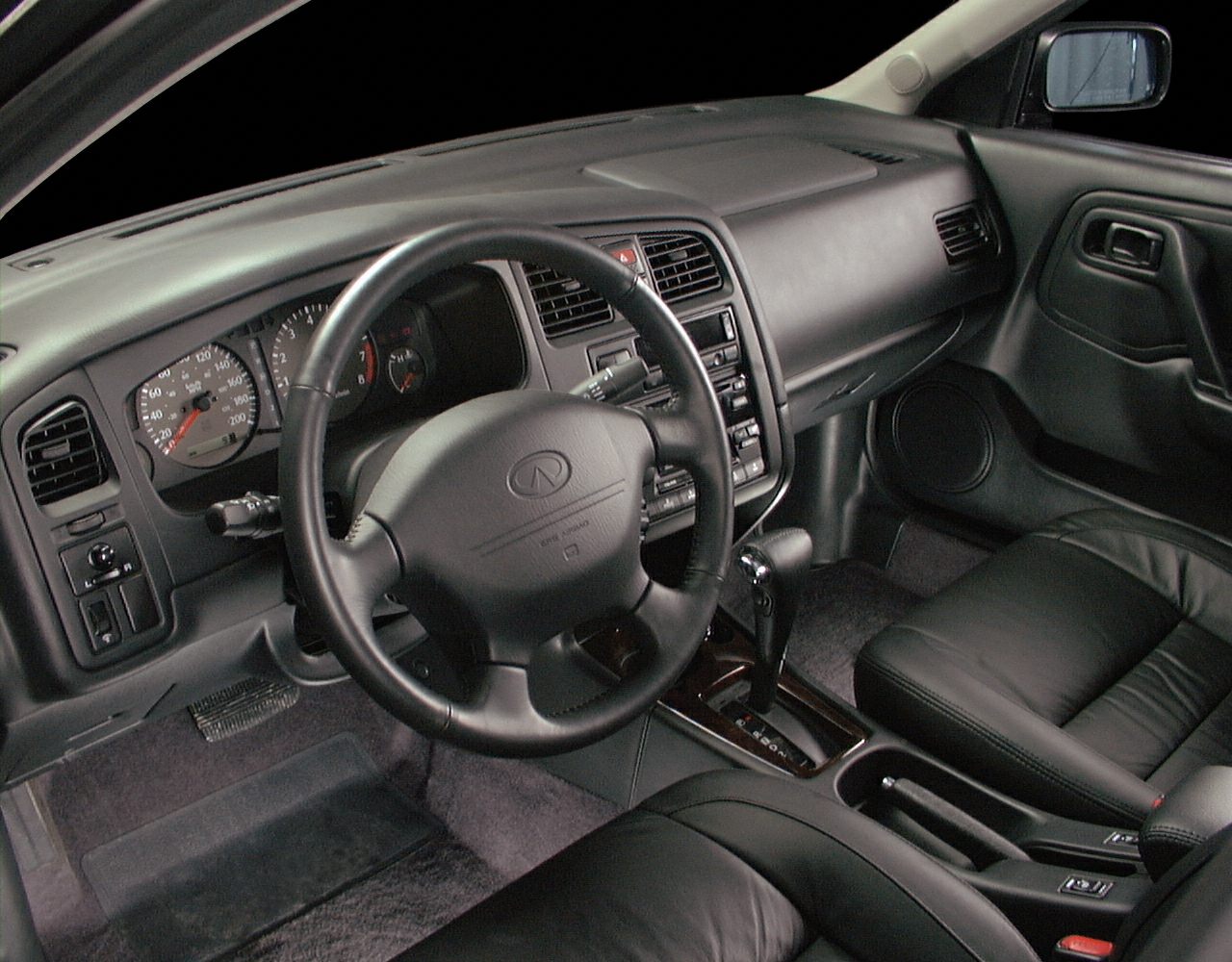 Classic car interior with dashboard and steering wheel.