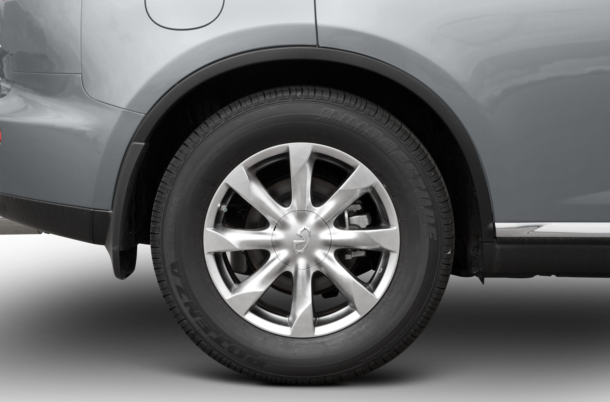 Alloy wheel with Bridgestone tire on a vehicle's wheel arch