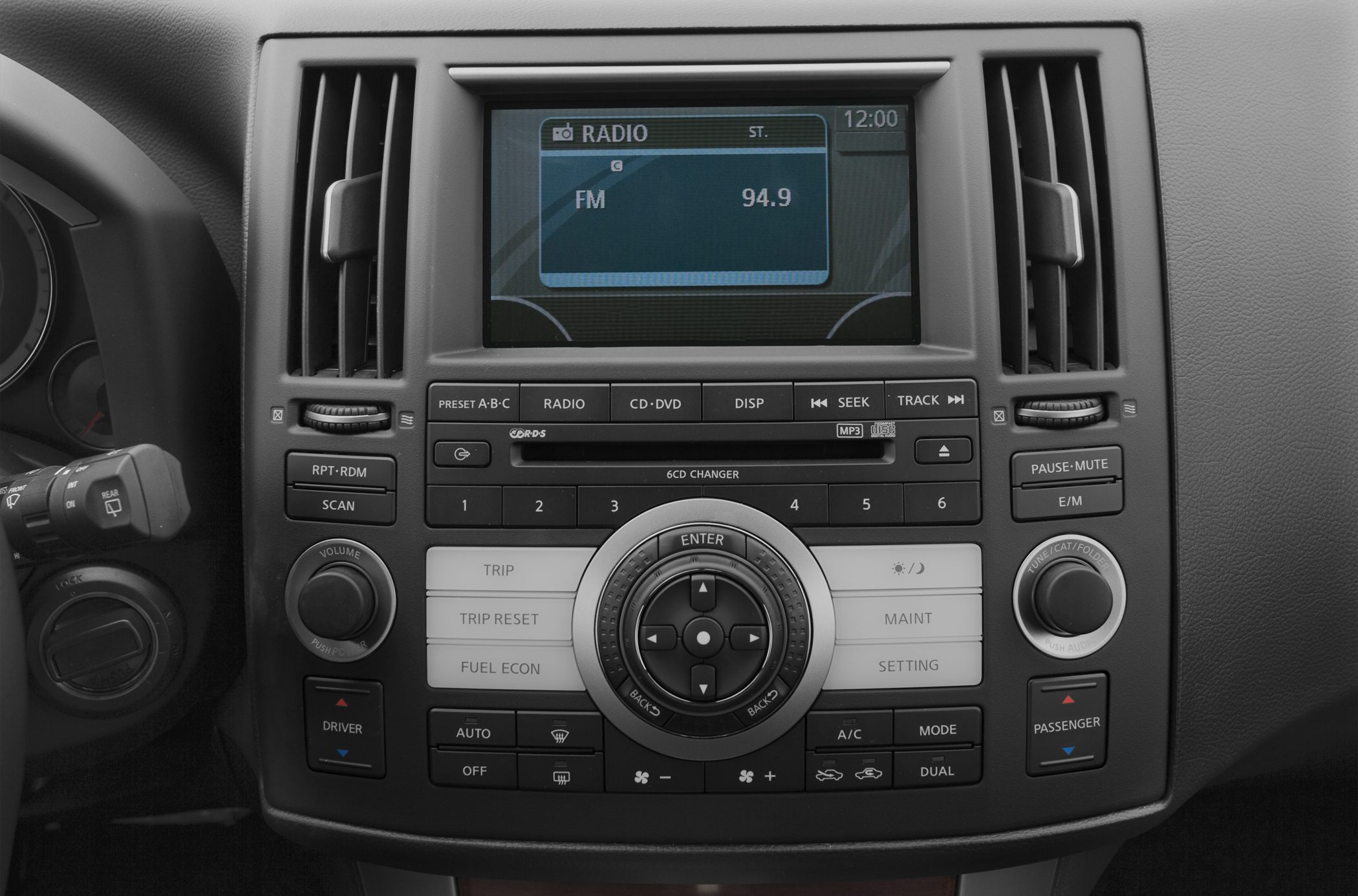 Radio and climate control panel with display, buttons, and dials