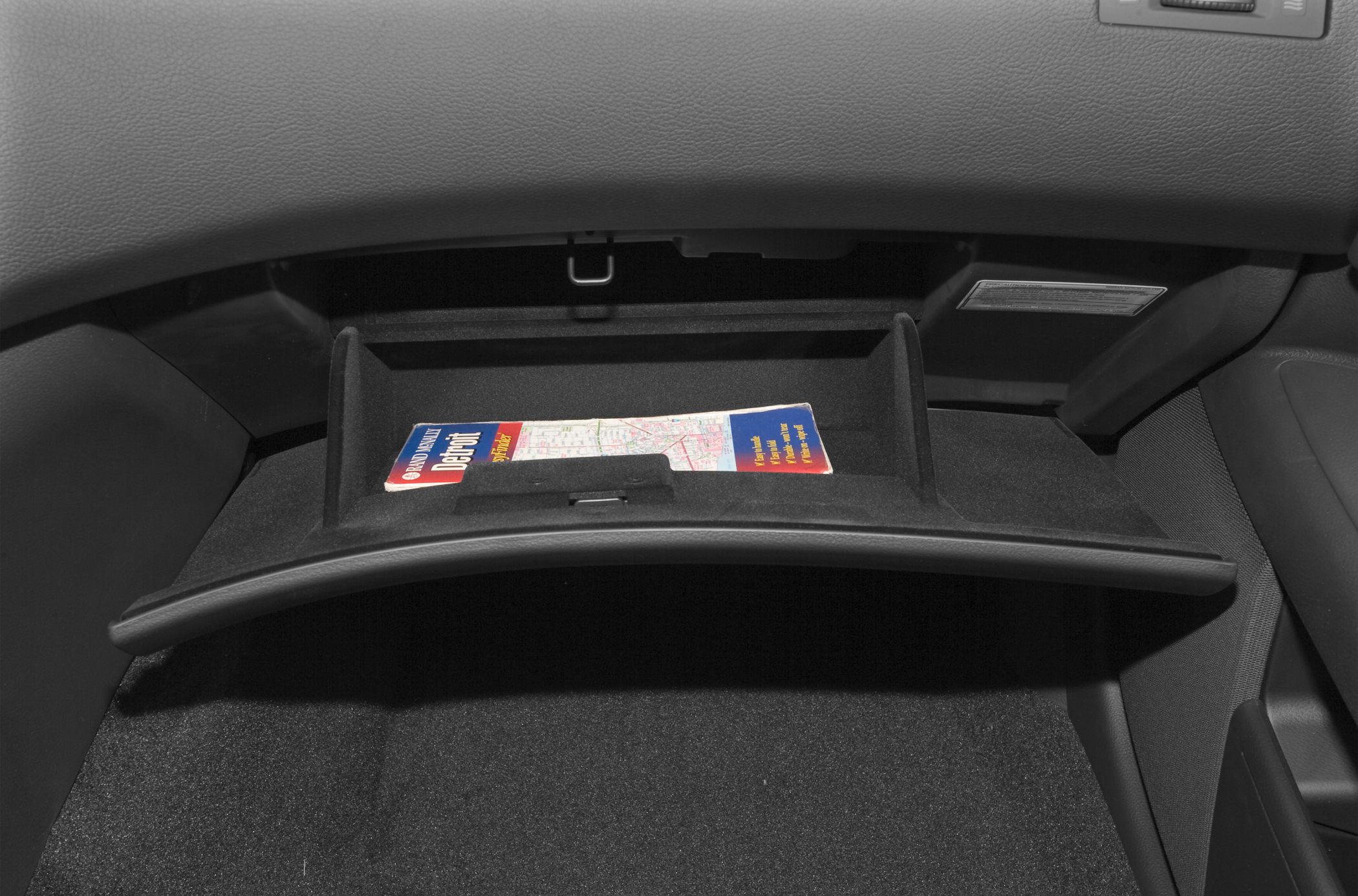 Open glove compartment with map inside