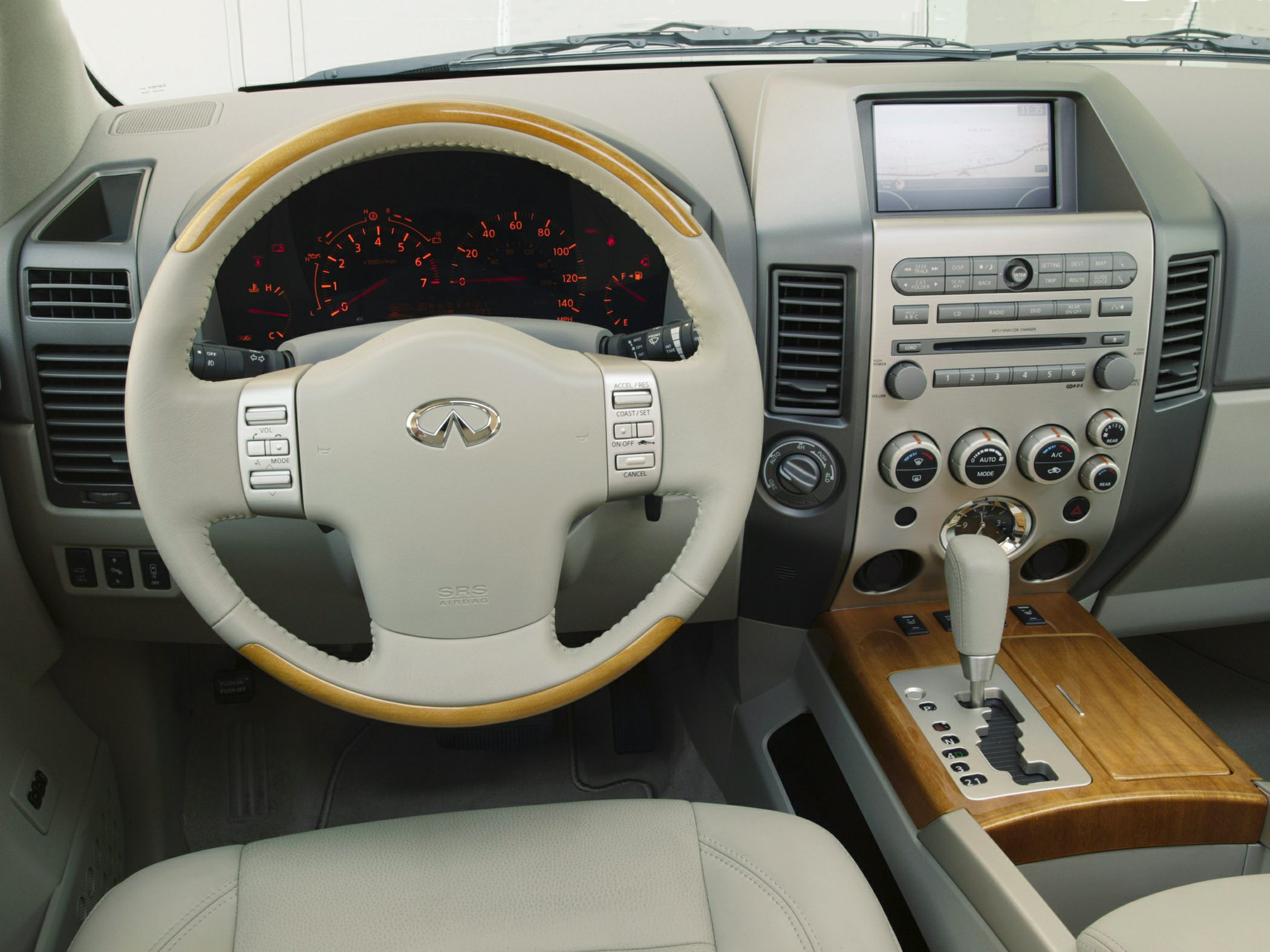 Leather steering wheel, wood trim center console, dashboard with GPS screen
