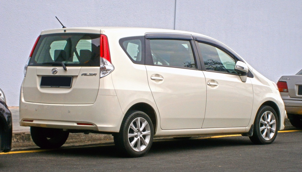 Rear side view of an MPV with tall rear door and alloy wheels.