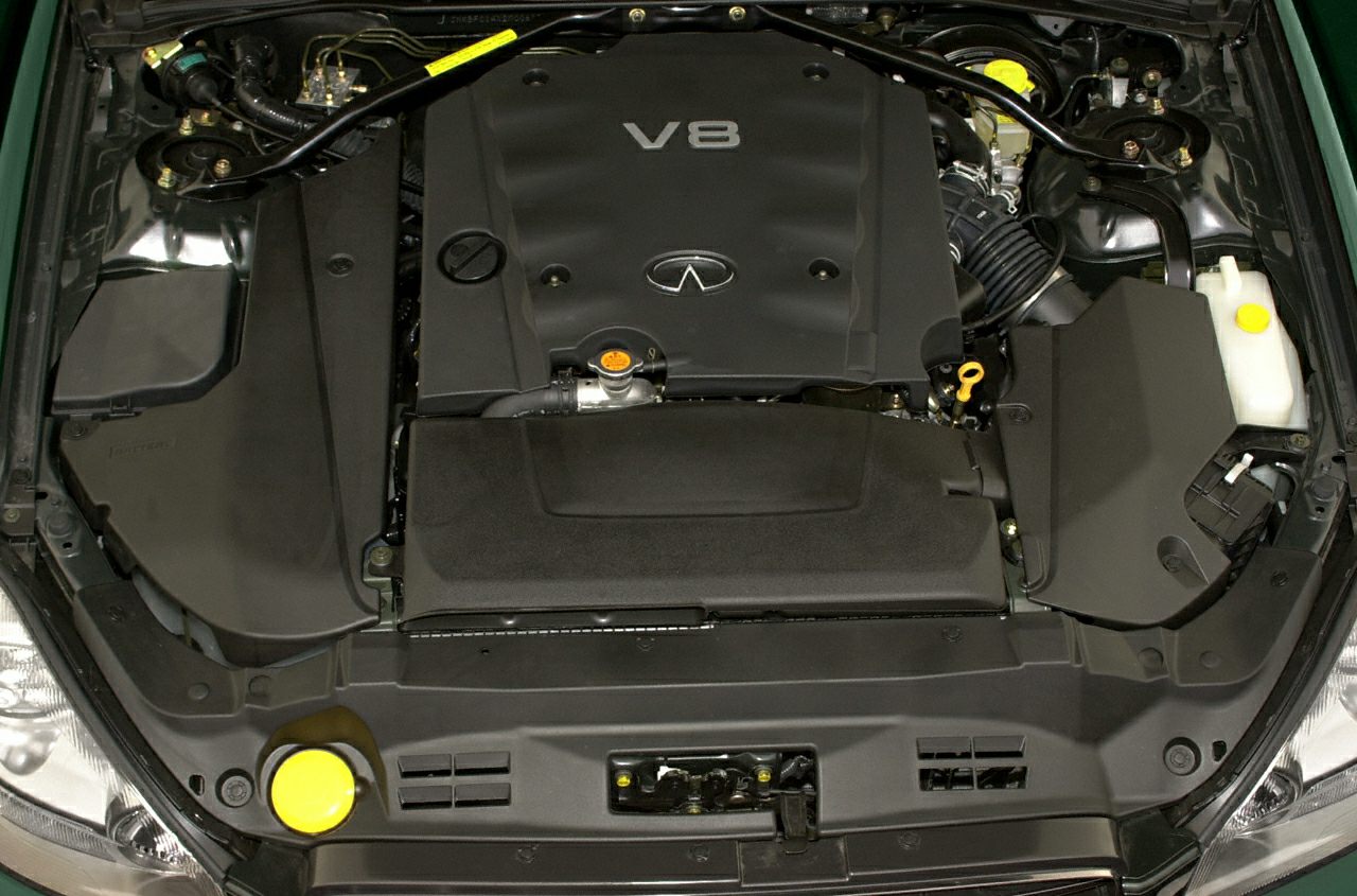 V8 engine compartment with engine cover and components