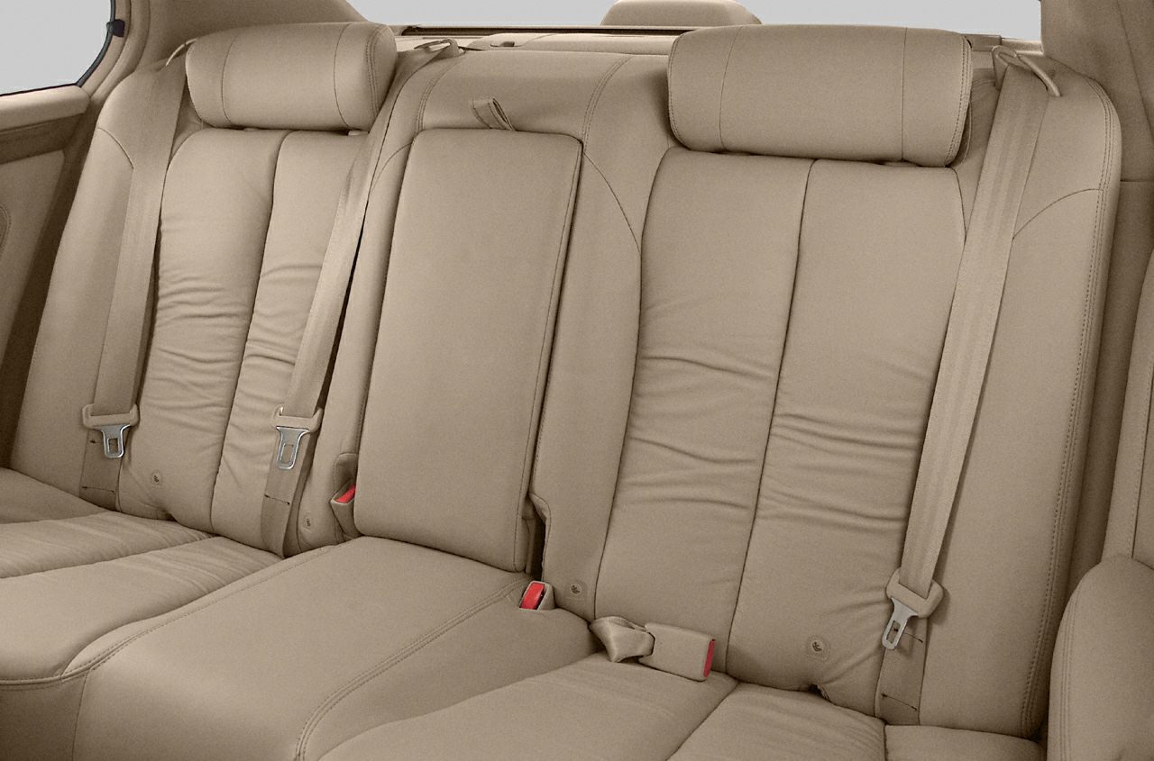 Beige leather rear seats with headrests and seat belts