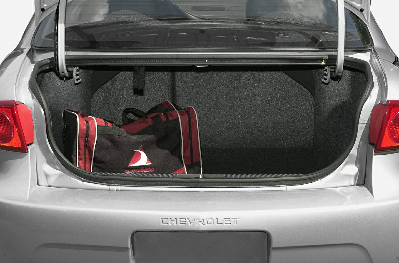 Open car trunk interior with travel bag