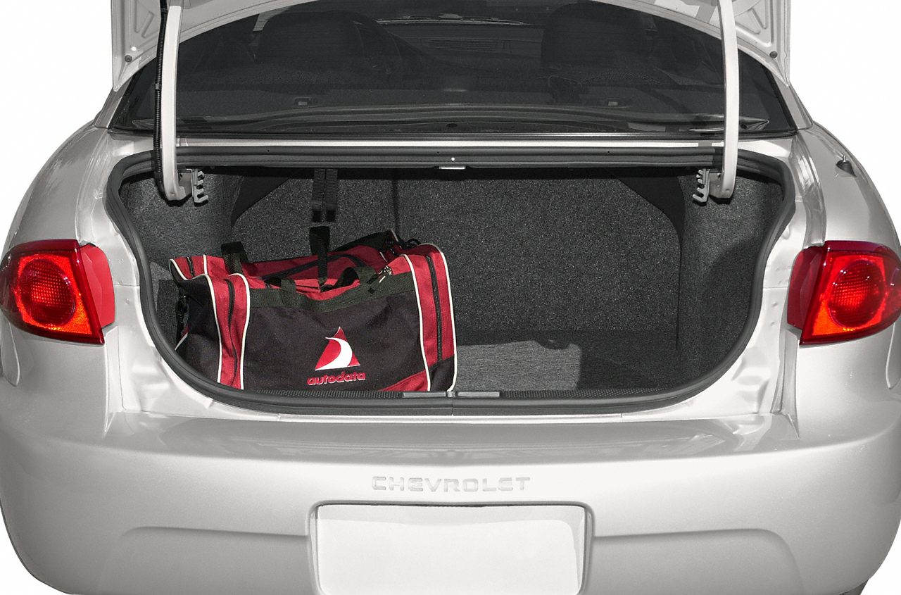 Open car trunk with spacious interior and a sports bag