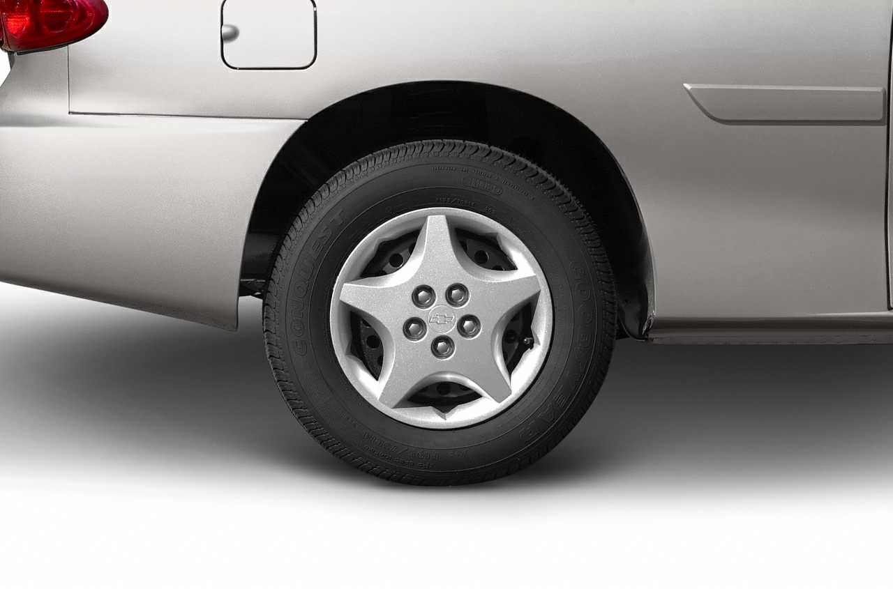 Five-spoke alloy wheel and tire close-up