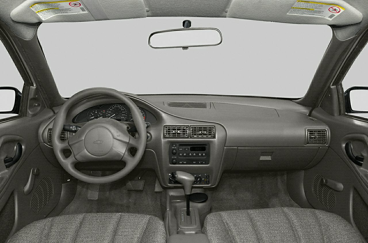 Steering wheel, dashboard, automatic gear selector, and air vents in car interior