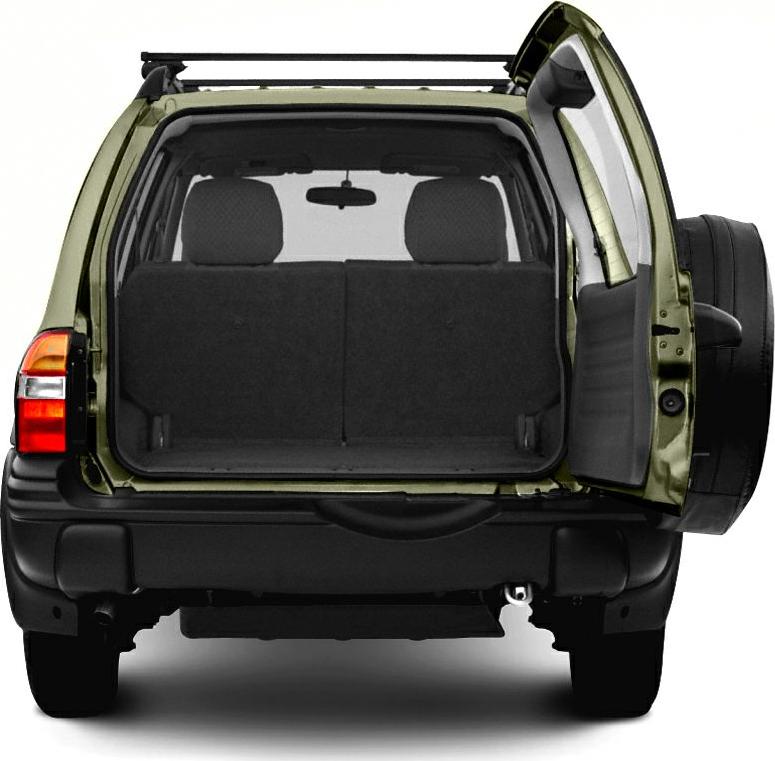 Open rear cargo space with side-hinged door of an SUV
