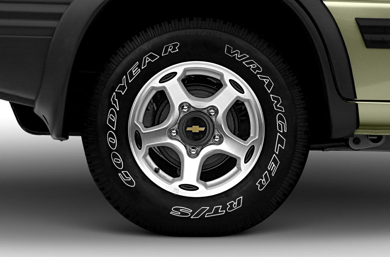 Close-up of alloy wheel with Goodyear Wrangler RTS tire on a vehicle.