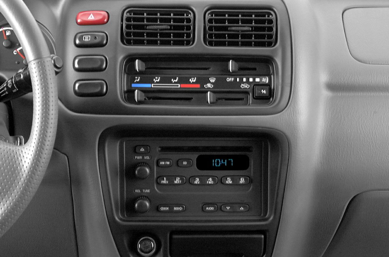 Dashboard featuring radio display and manual climate controls