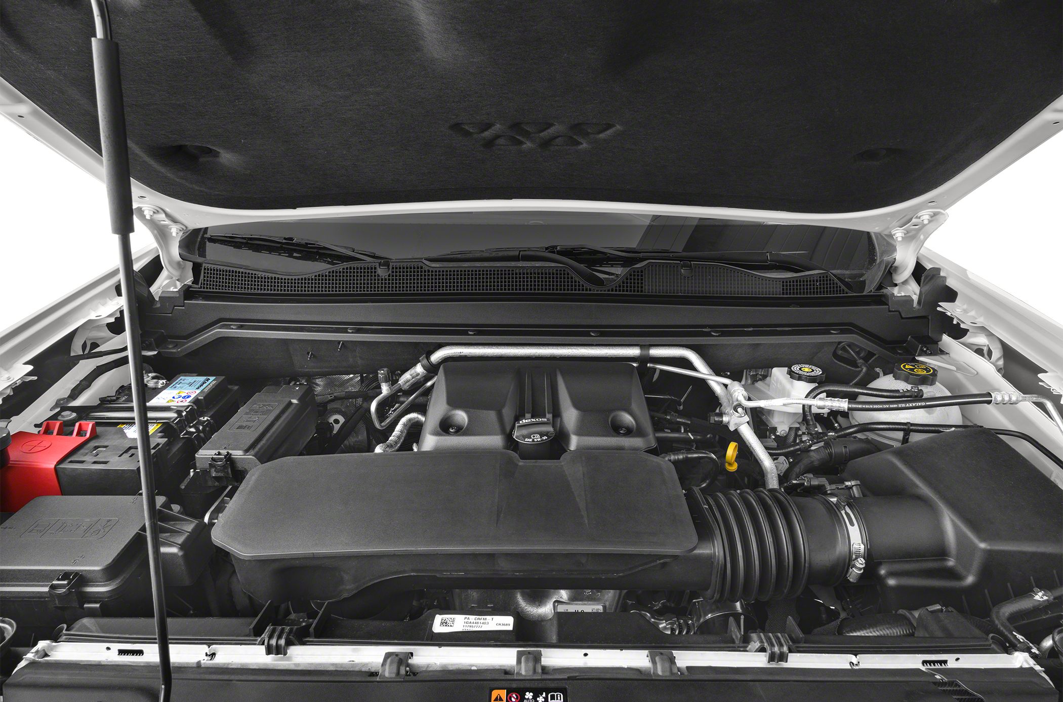 Engine bay with various components under hood