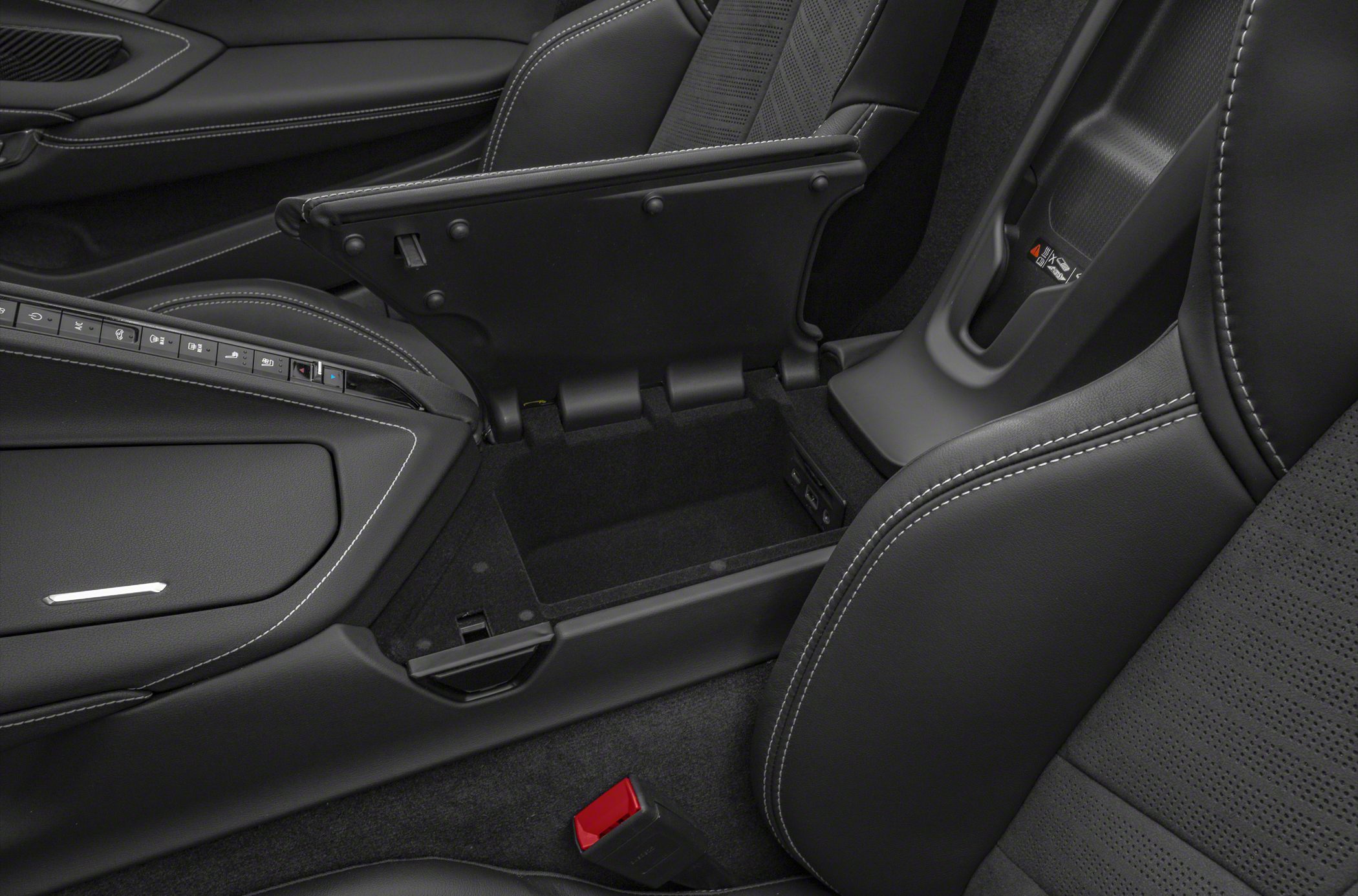 Center console storage compartment with interior controls and black stitched upholstery