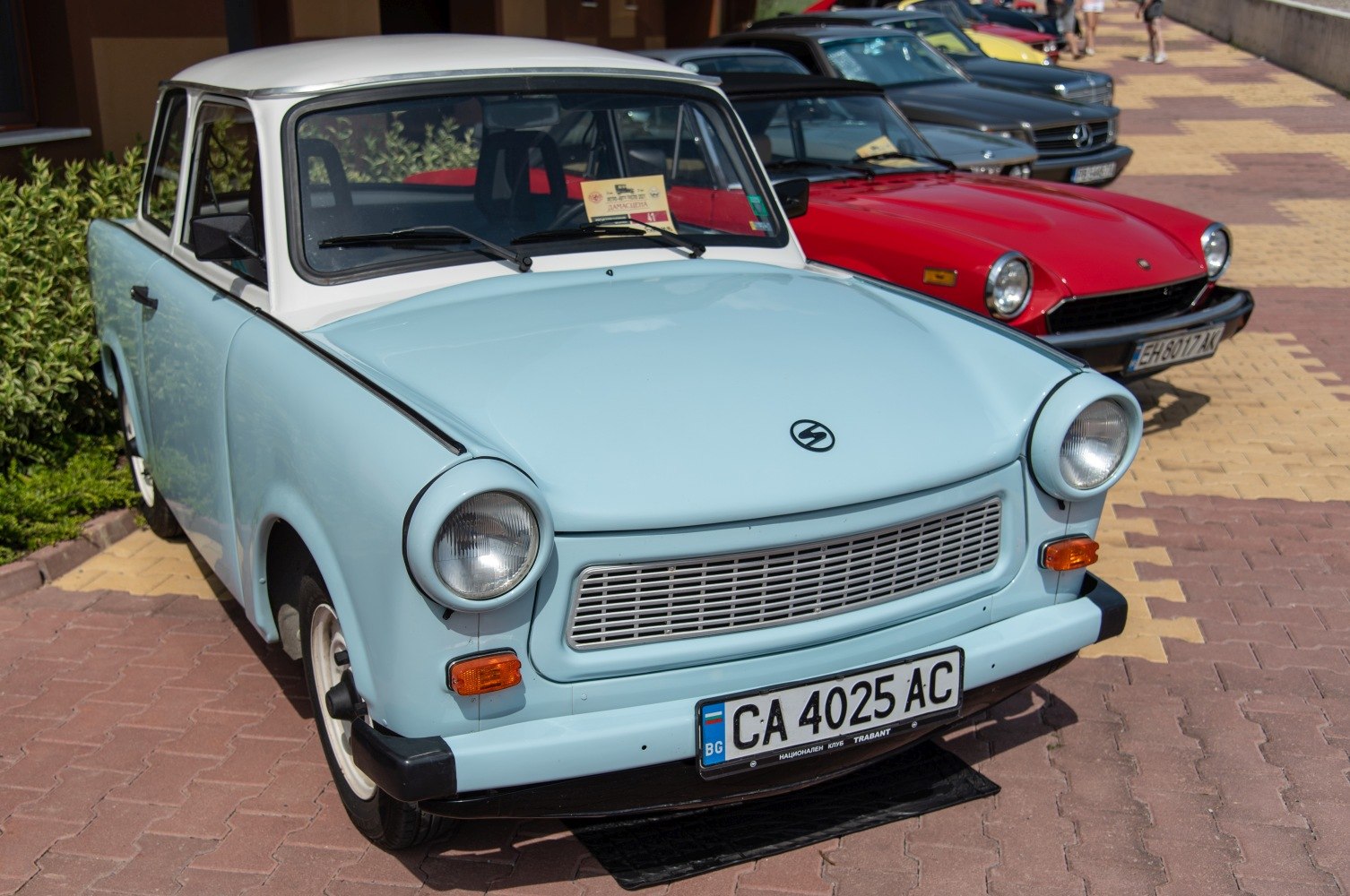 Front view with round headlights and classic grille of a vintage Eastern European automobile.
