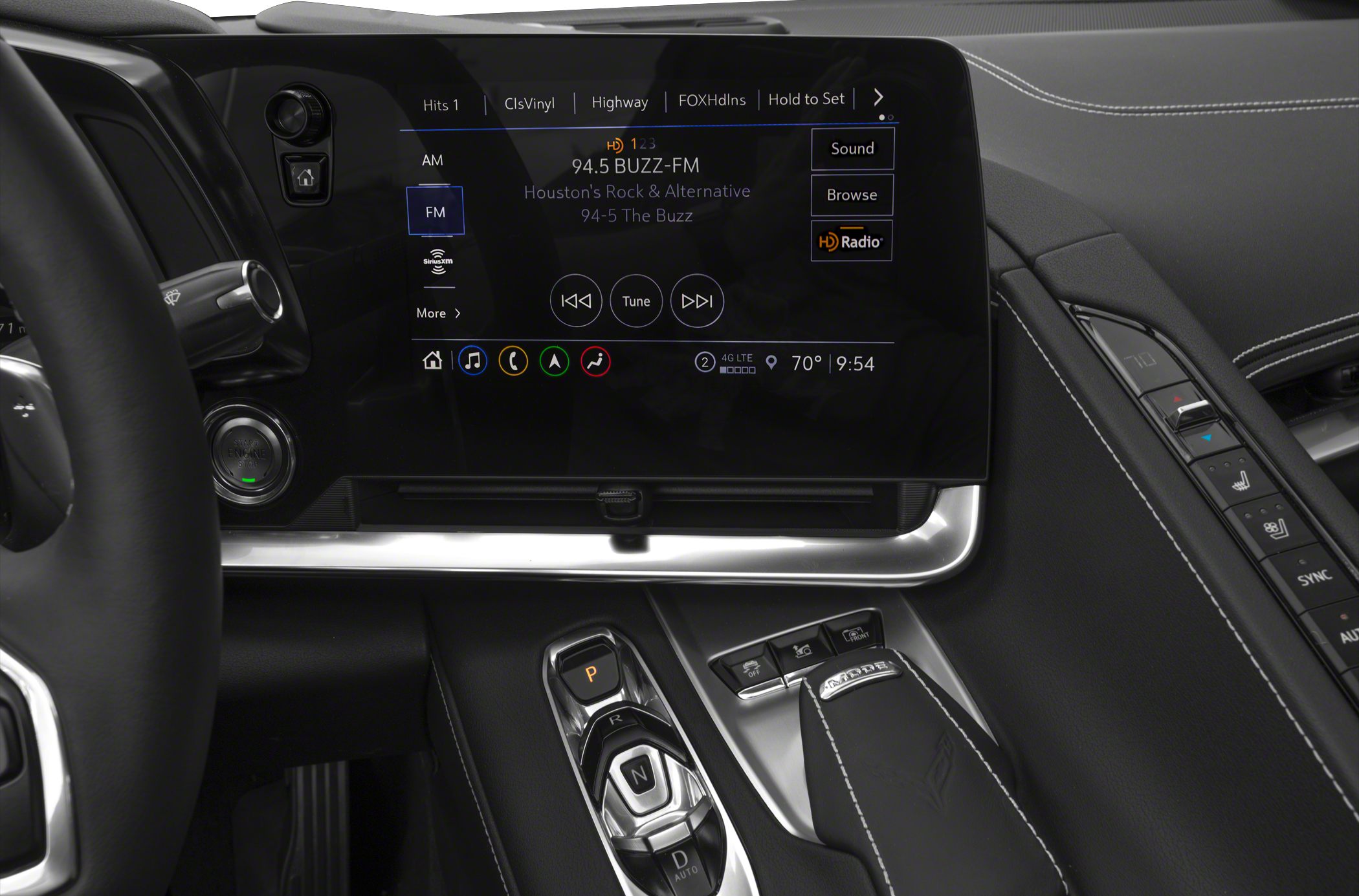 Modern infotainment touchscreen and gear selector in car interior