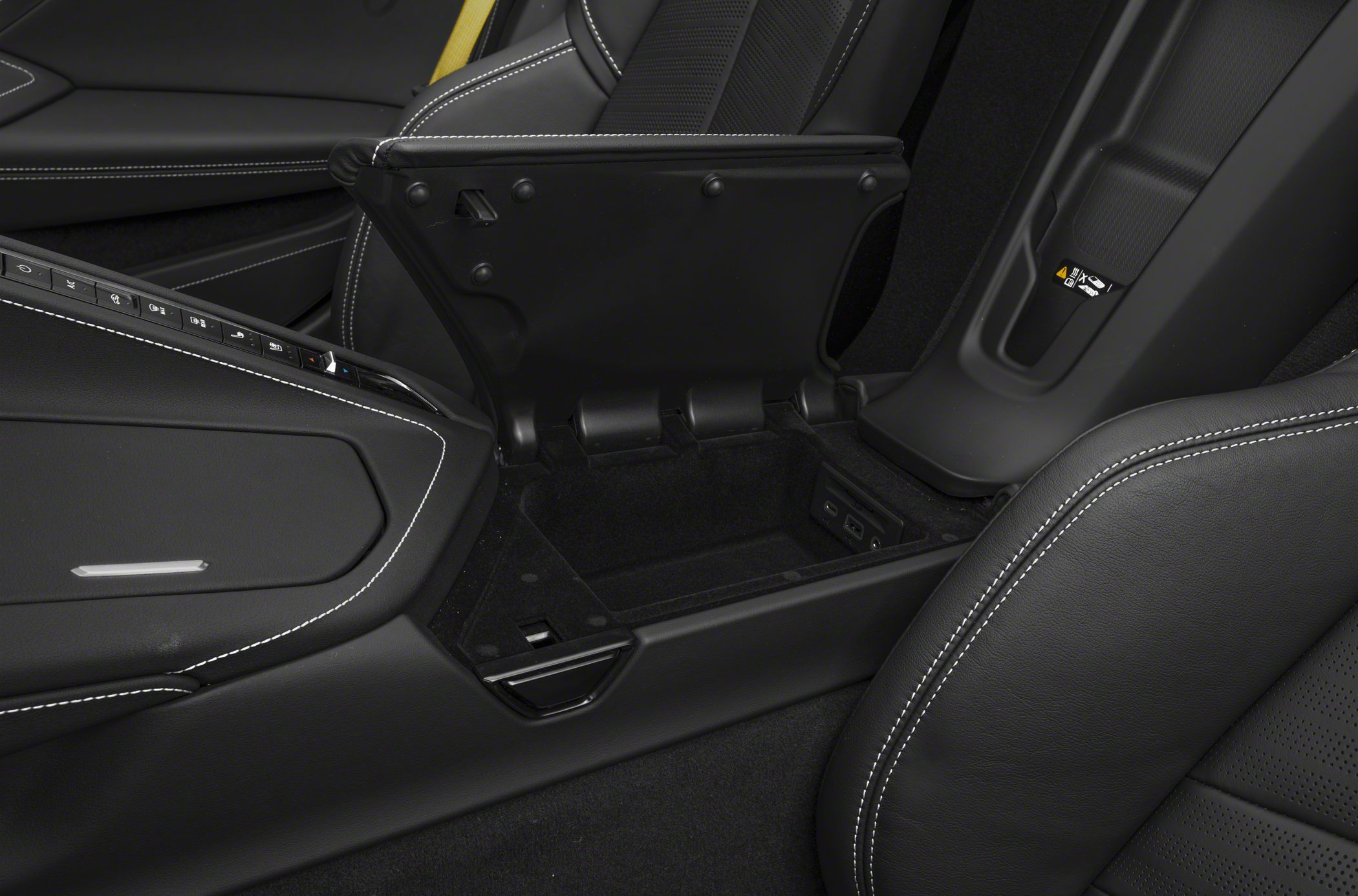 Center console storage compartment with leather upholstery and control buttons