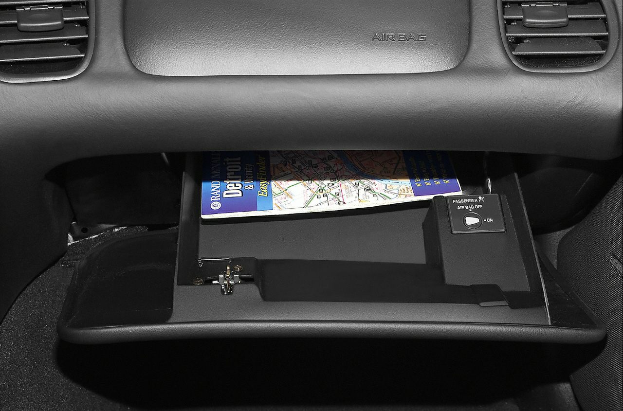 Open glove compartment with passenger airbag on/off switch