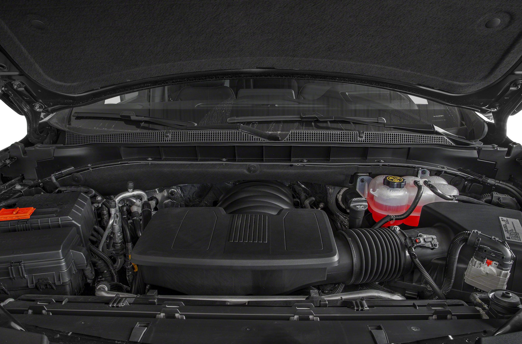 Engine compartment with intake housing and fluid reservoir