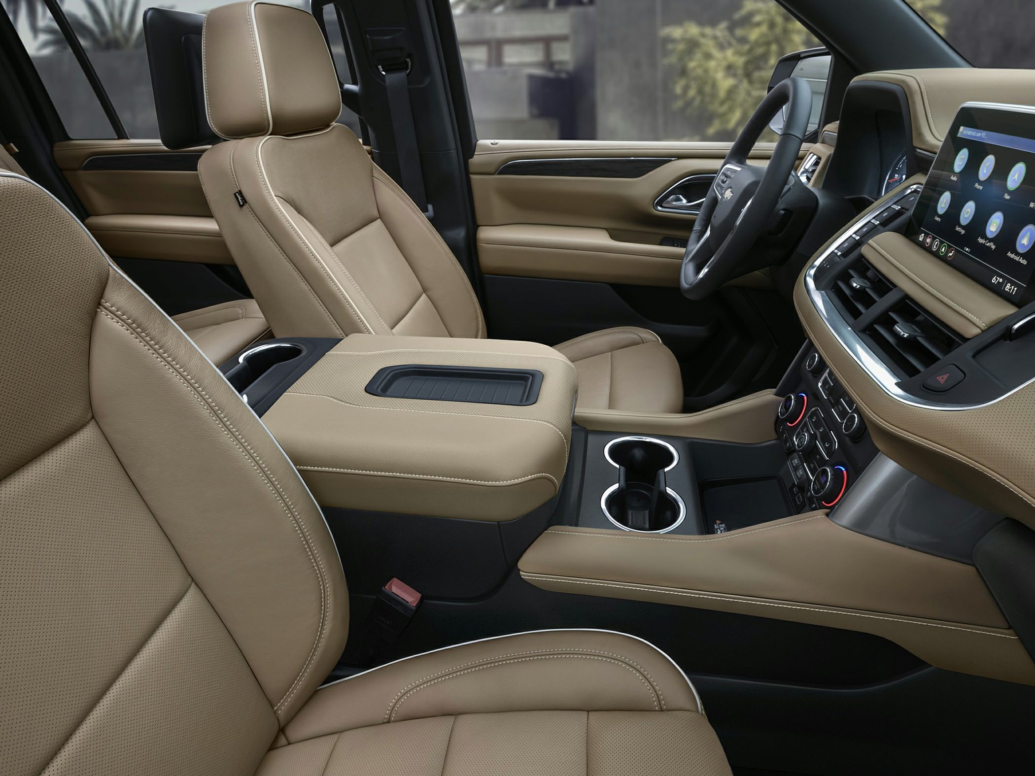 Tan leather seats with modern center console and infotainment system