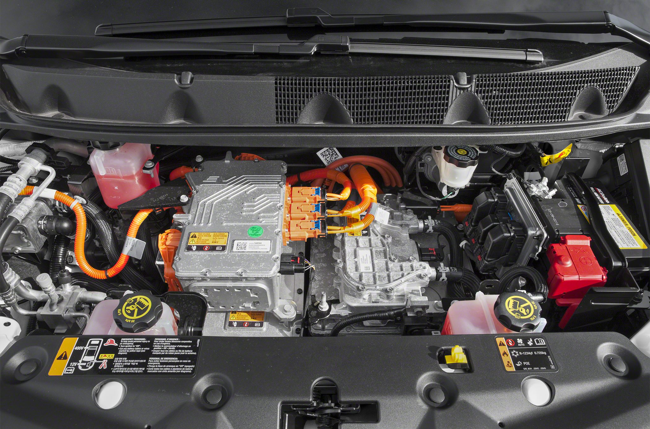 Close-up of electric powertrain with battery connections and wiring harness.