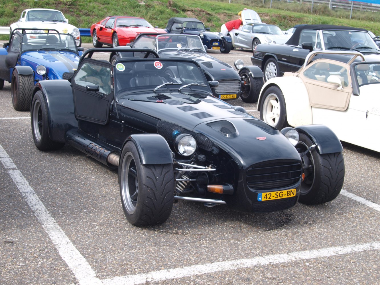 Lightweight open-top sports car with exposed front suspension and wide tires