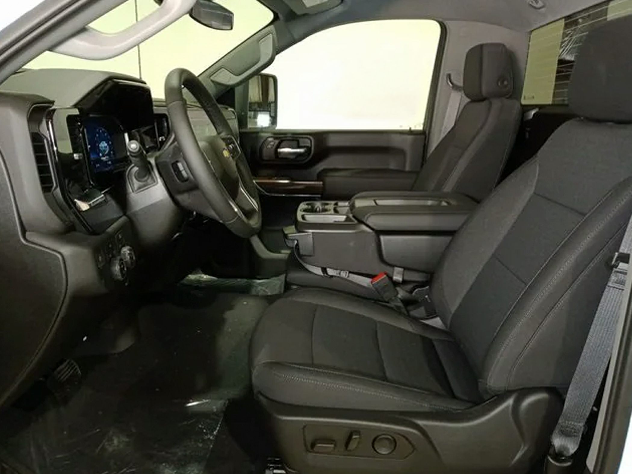 Front seats and dashboard interior with center console and steering wheel